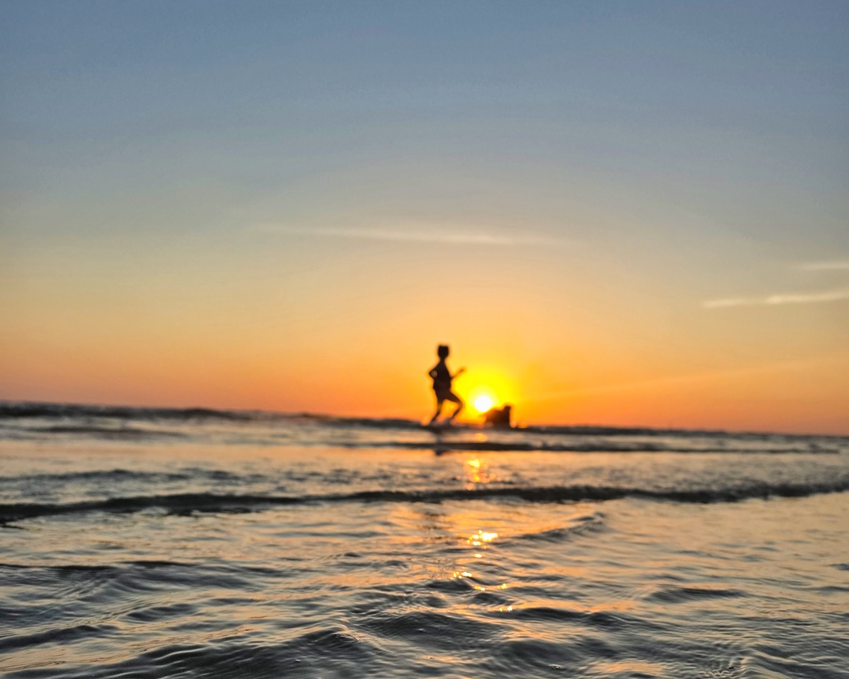 Heather Davis on the Emerald Coast at sunset